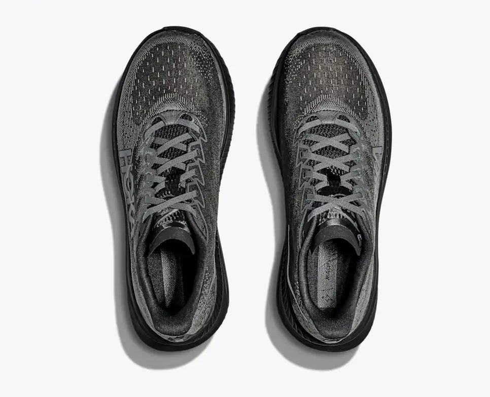Black Hoka running shoe on a white background