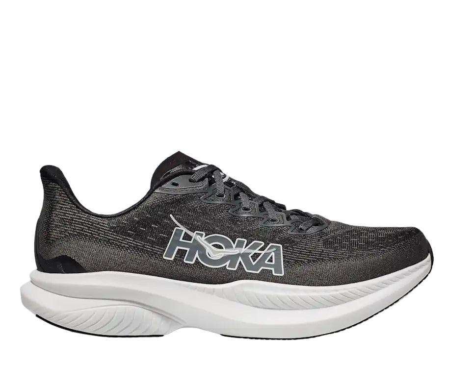 Black running shoe with white sole on a light gray background
