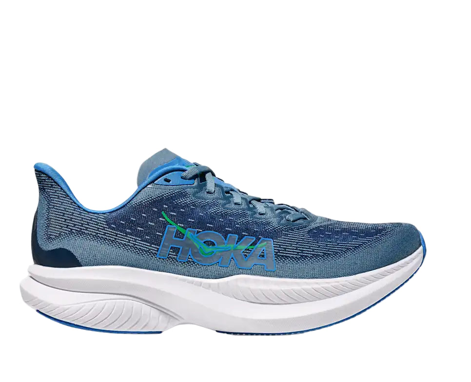 Blue running shoe with white sole on a white background