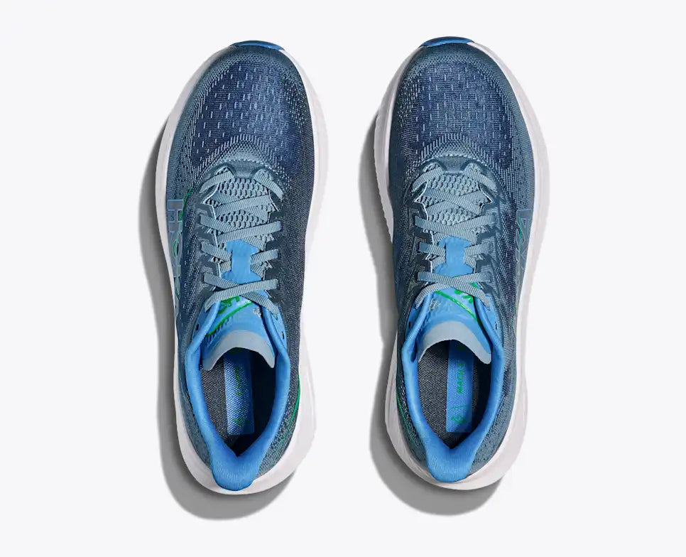 Blue running shoe with white sole on a white background