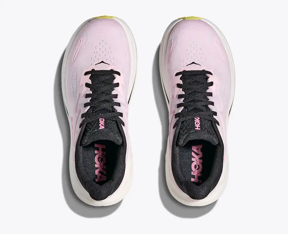 Pink running shoe with black accents on a white background