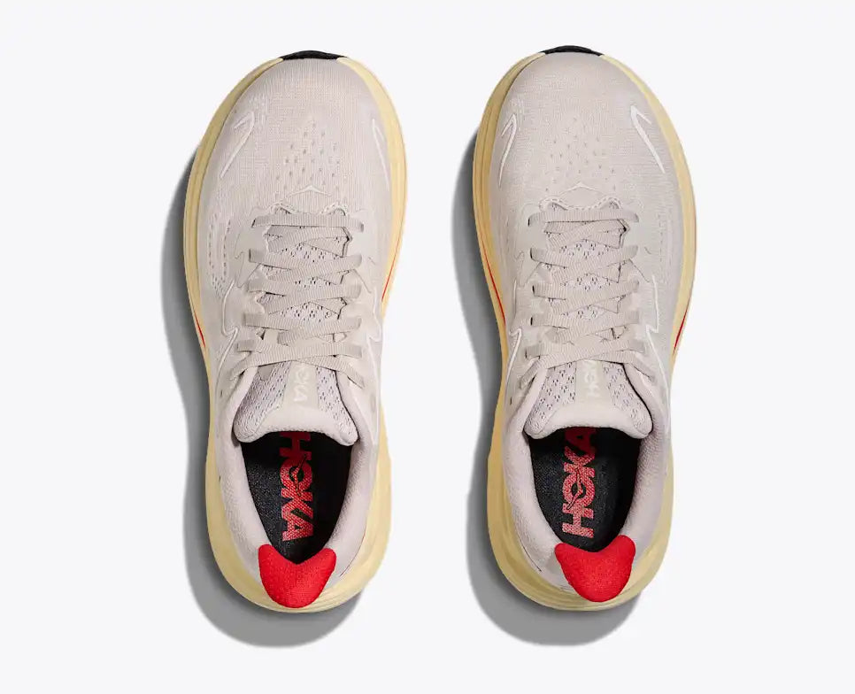 Gray running shoe with red accents on a white background