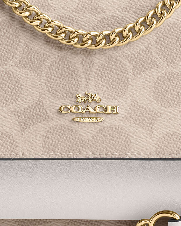 Mini Klare Crossbody Bag In Signature Canvas Signature Canvas-Gold-Sand-Chalk Signature Canvas-Gold-Sand-Chalk